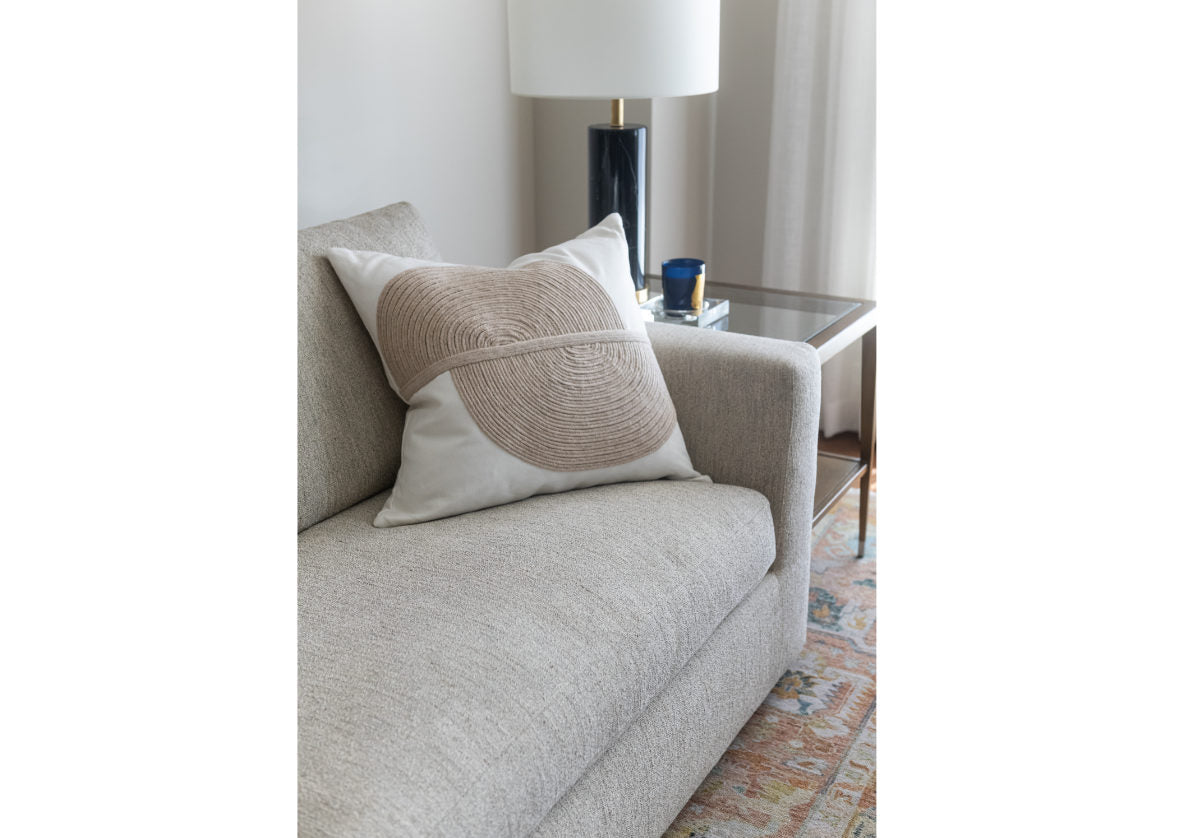 august sofa with pillow on top.