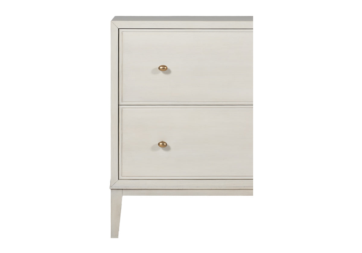 close up of the corner of the ava nightstand with gold knobs.