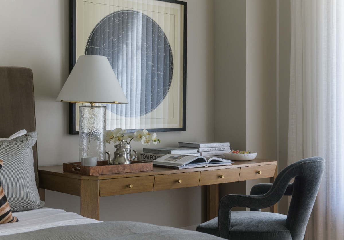a picture of a bedroom with the brooklyn desk off to the right and the bobbie chair placed in front.