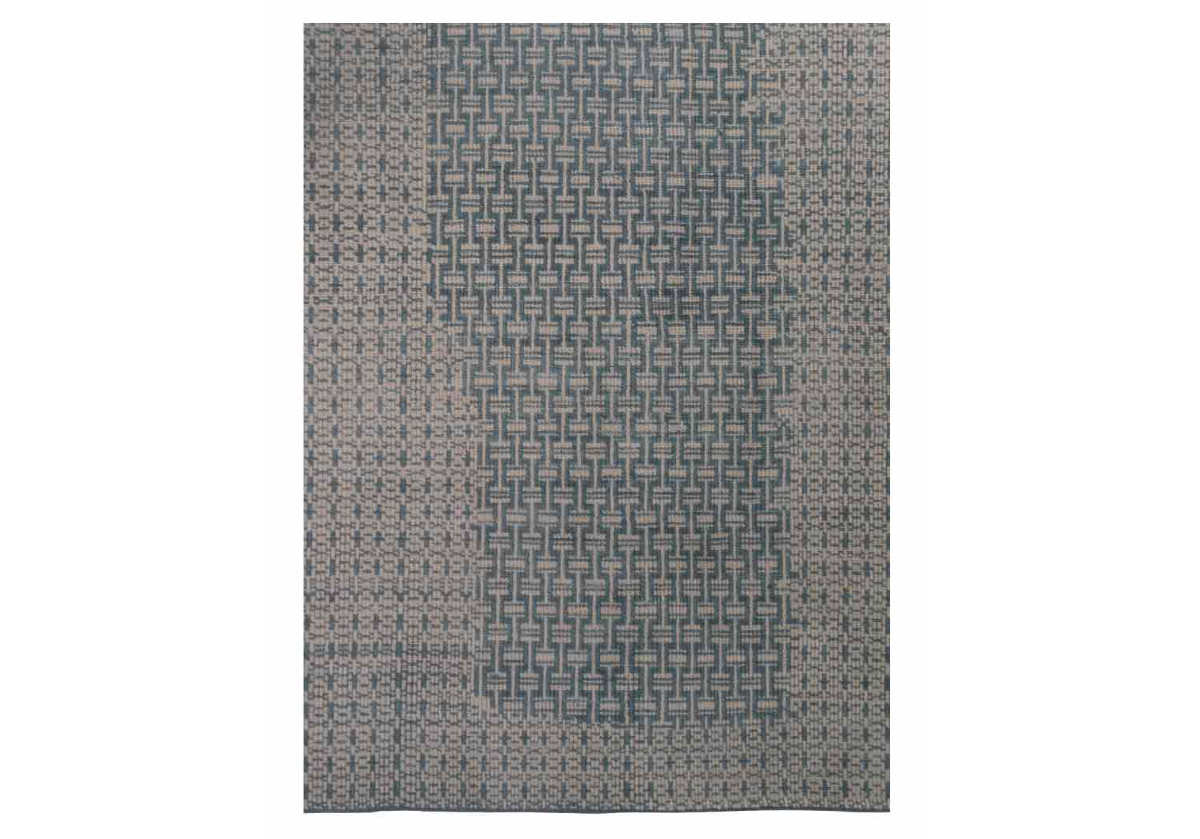 closeup of chainmail blue rug with woven designs.