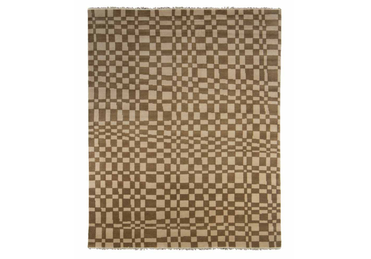full picture of the chess rug in taupe. Checkered tan and light brown squares add a statement to any room.