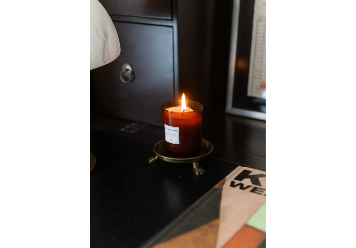 small clawfoot dish holding a candle