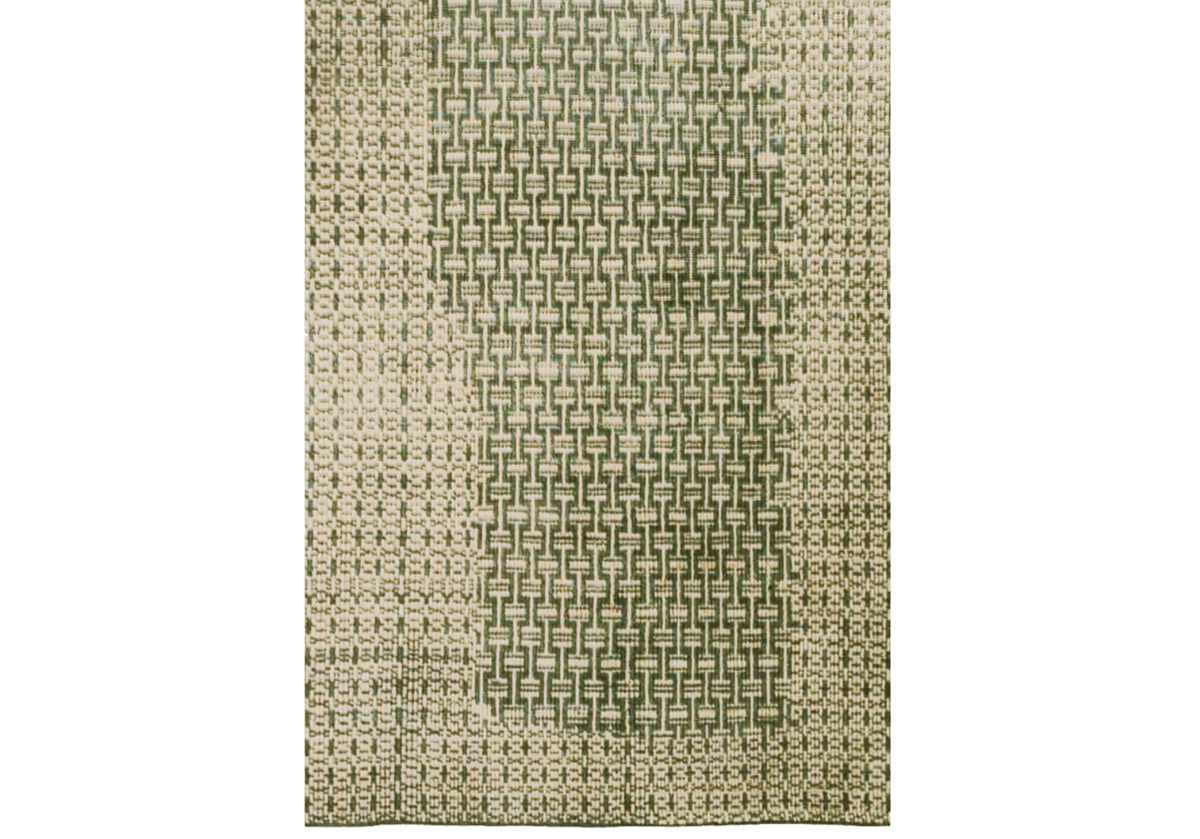 green rug chainmail rug close up of palm and green rug design.