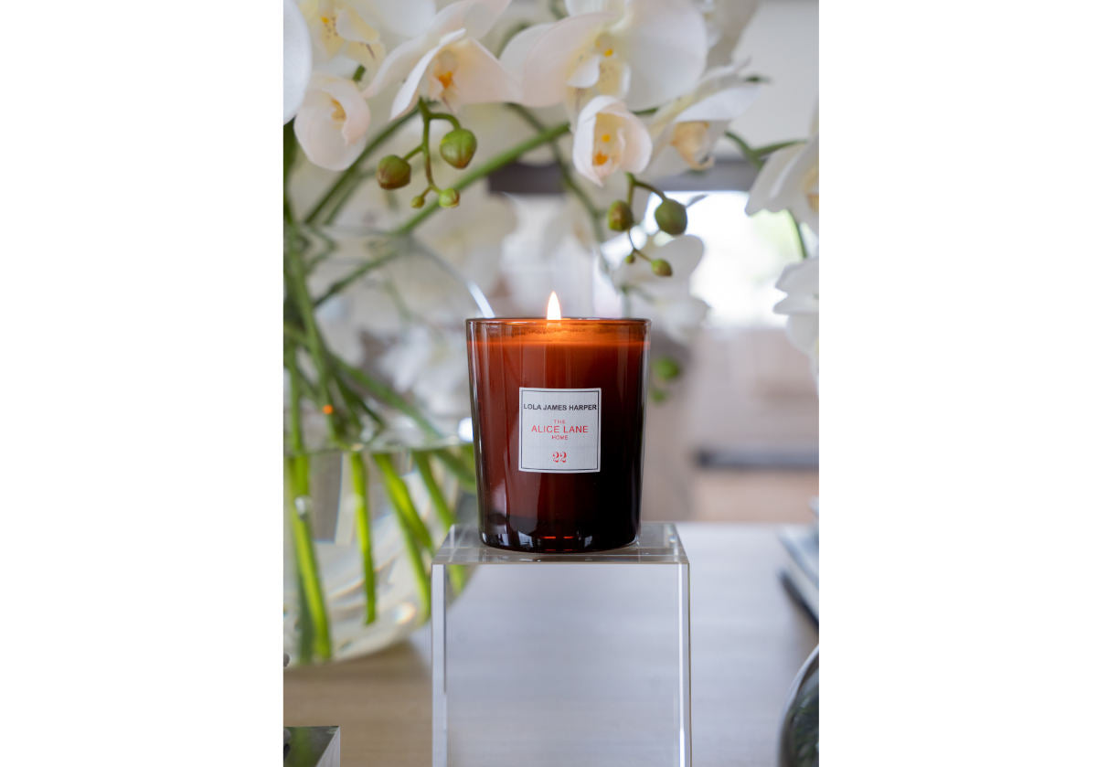 the large crystal cube can be seen with a lit candle on top of it.