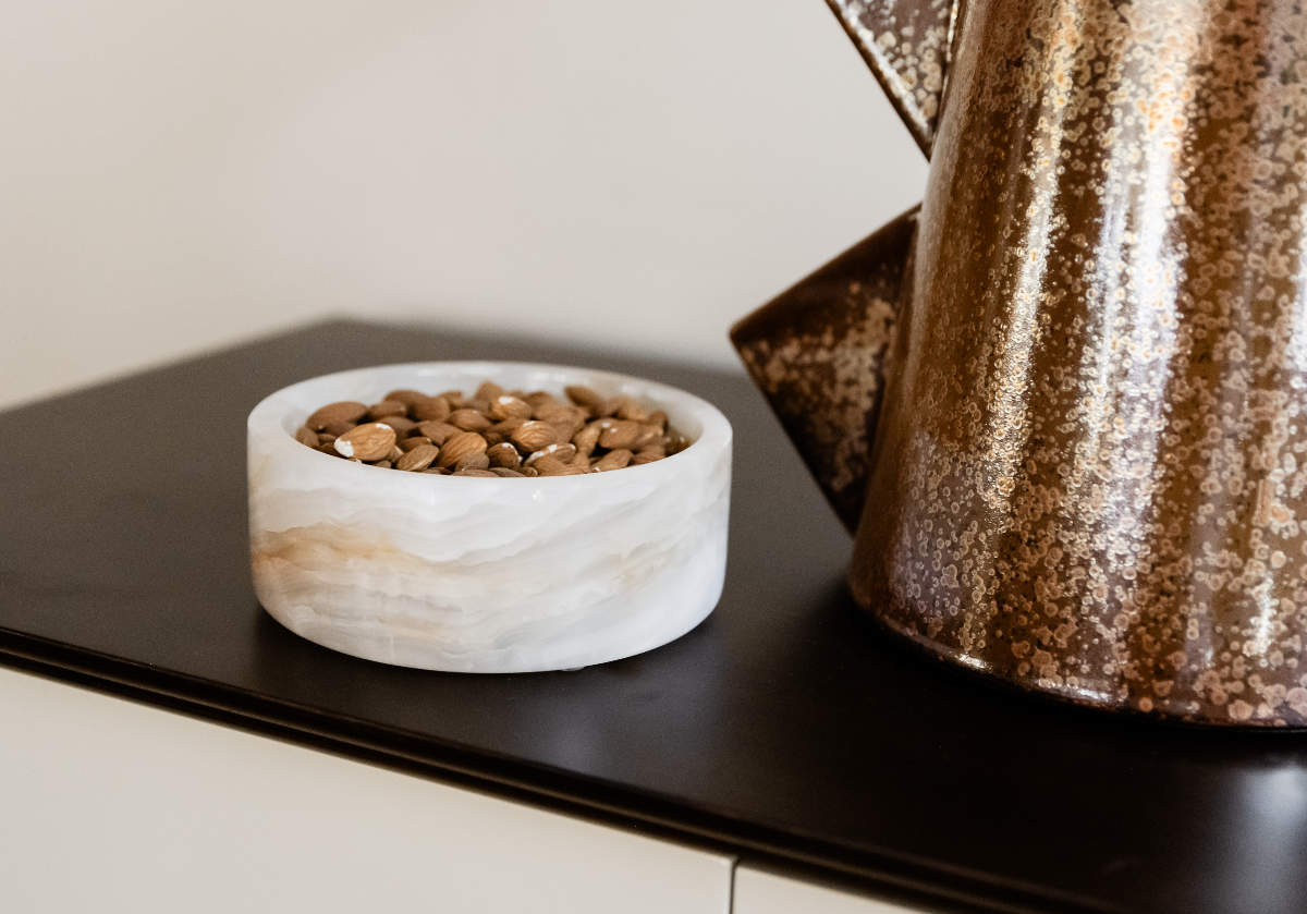 the angelo bowl is made of white onyx and makes for a lovely decorative dish or bowl
