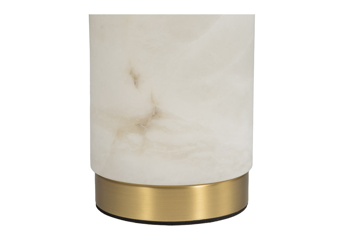 close up of bottom of lamp, golden base with white and marble frame.