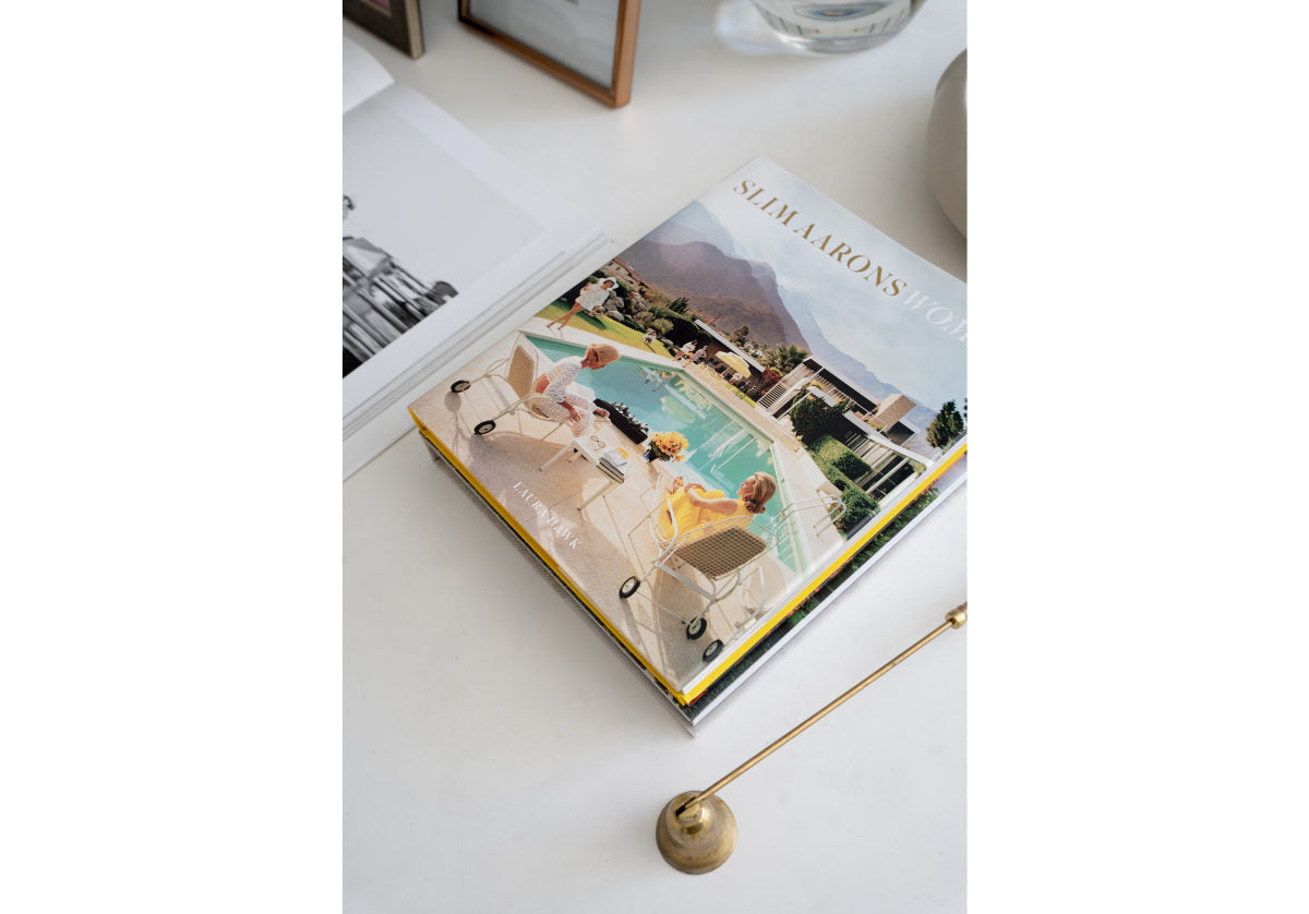 The ultimate in elegance, this candle snuffer elevates any candle setting with its elongated thin handle and traditional shaped bell. Its polished brass finish complements its design, lending a timeless quality. Pair with the Maison Tray for an added touch of sophistication. 