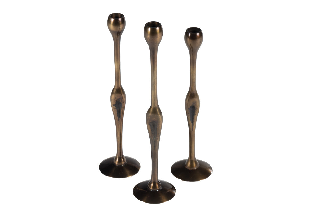 figure brass candlesticks can be seen on a white background.