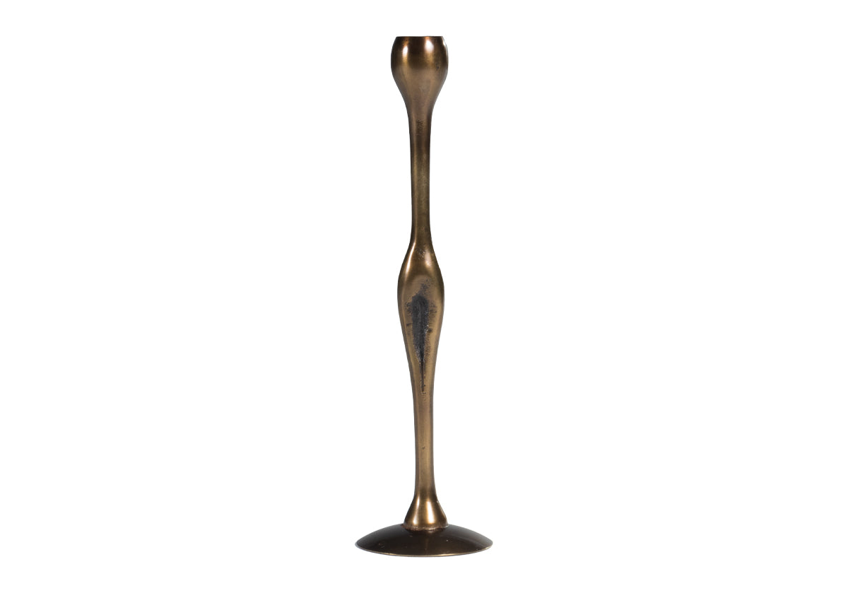 a medium brass candlestick on a white background.