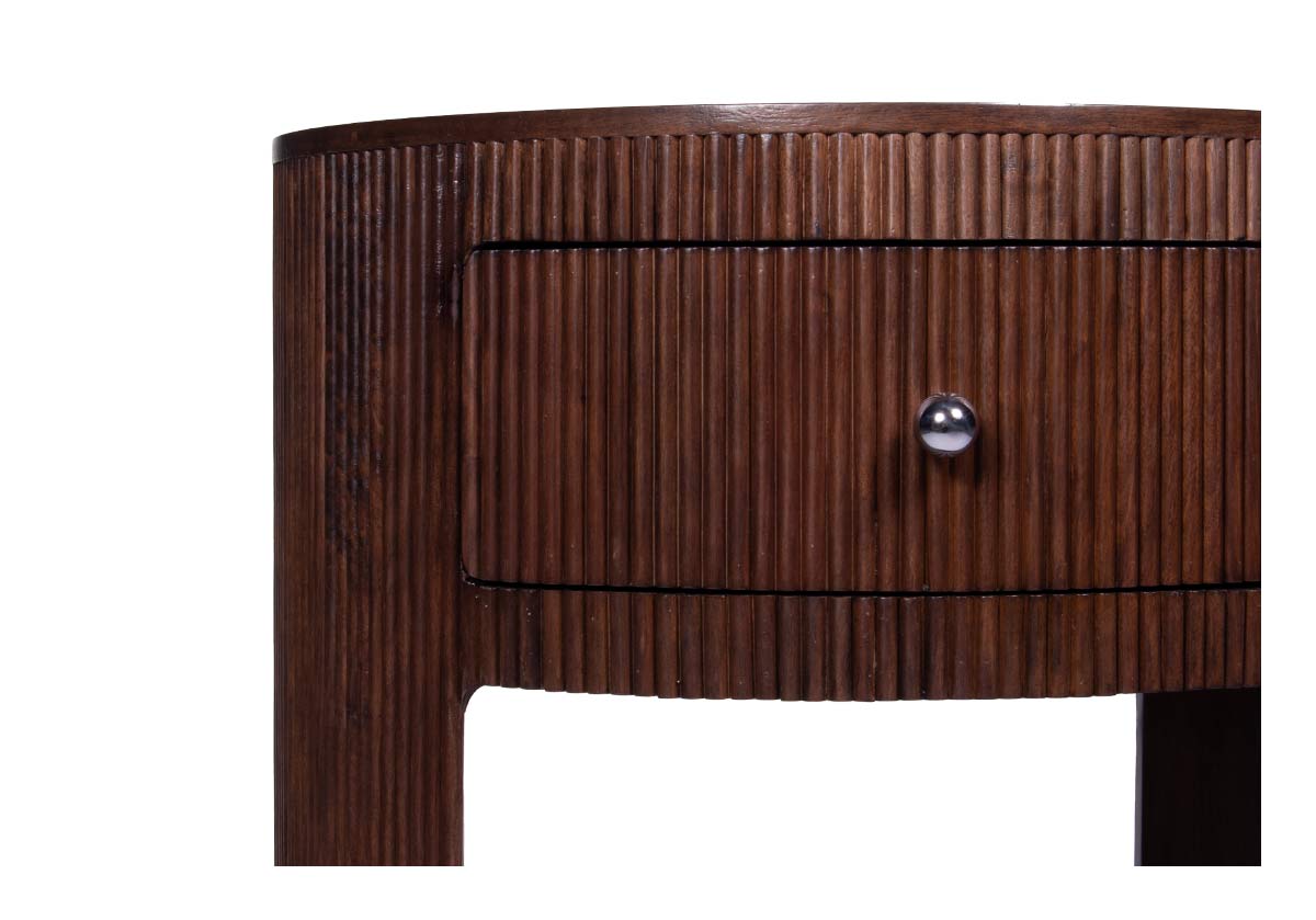studio photo of the cleo nightstand with silver hardware. close up of corner of the top of cleo nightstand.