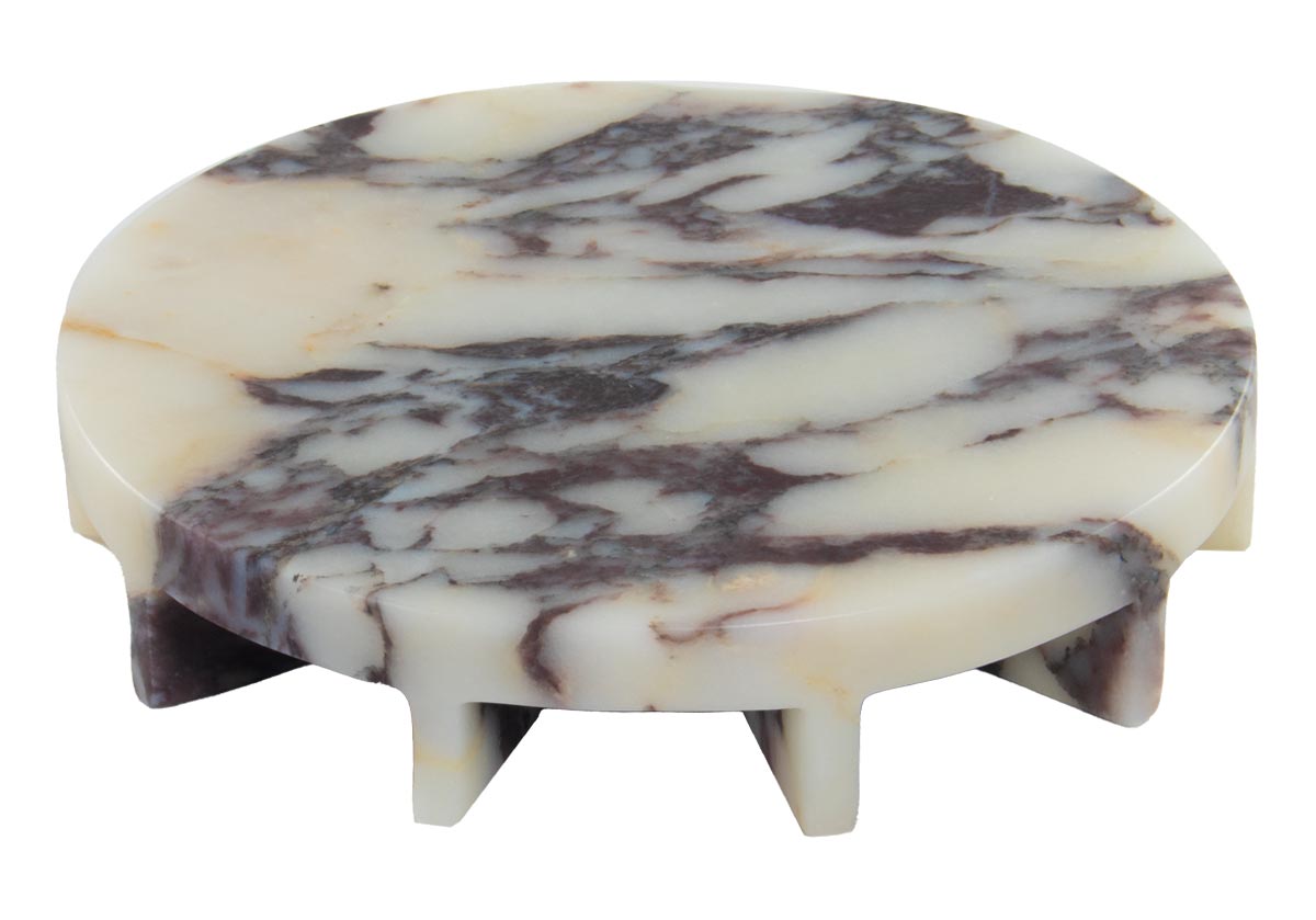the dolce tray, a marble slab in Calacatta Viola. Elevated with 8 radius legs.