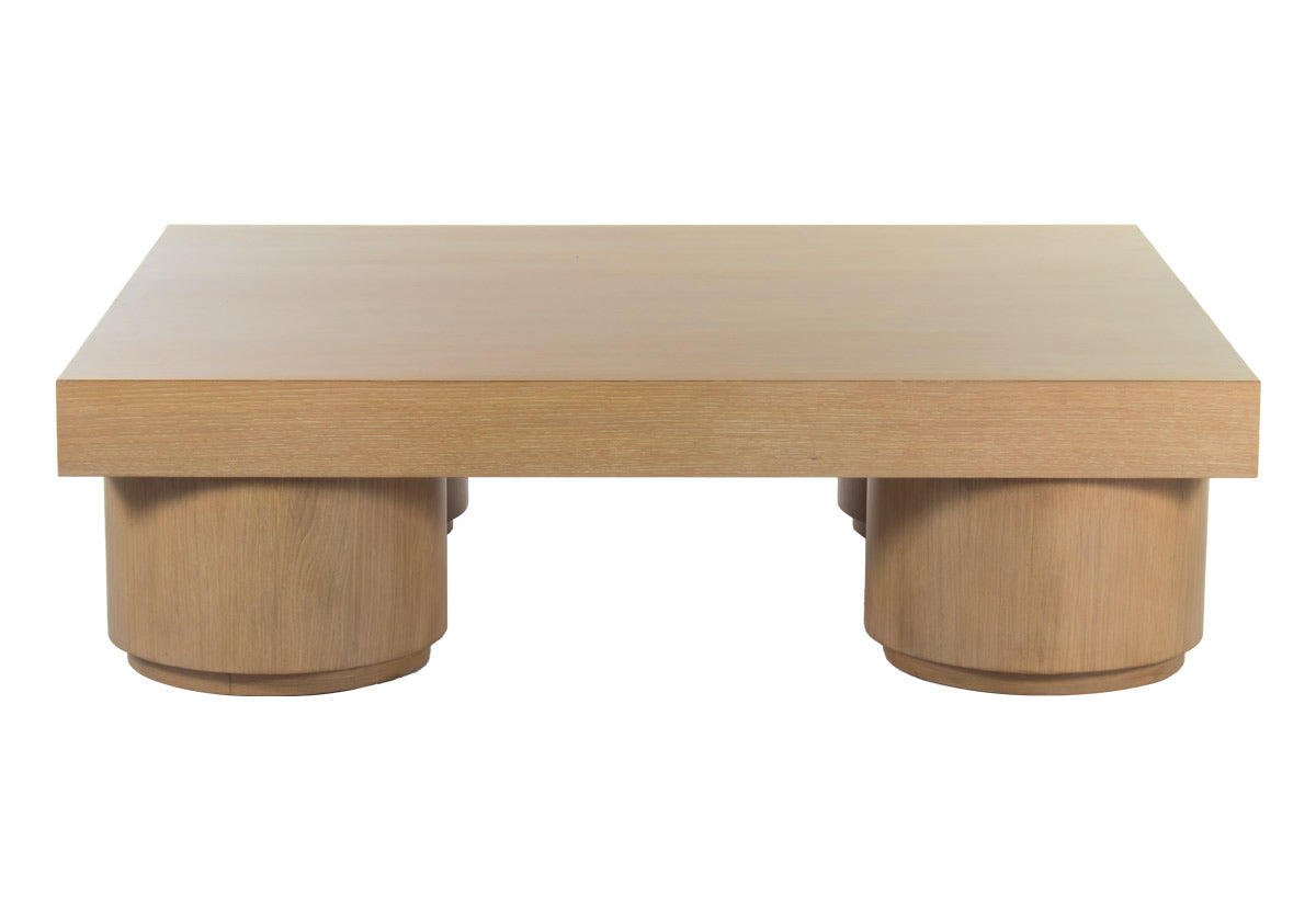 J. Bennett Collection designed by Jessica Bennett. This cocktail table is scaled to help any room feel generous with its large-scale design elements. The Duke features four cylindrical legs with a small step in, creating a unique floating effect. Its beautiful oak form showcases natural linear grain for an added touch of warmth and sophistication.