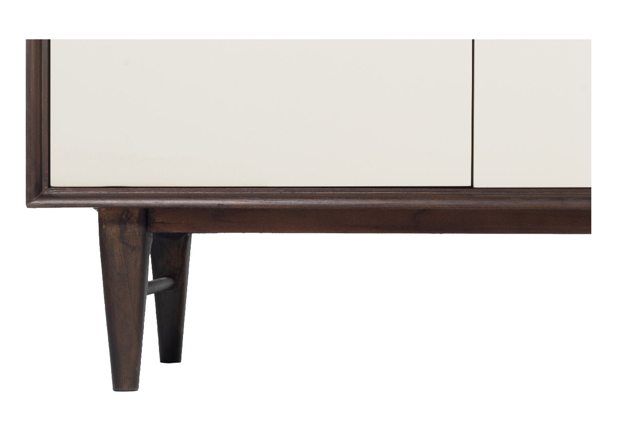 close up photo of frances sideboard leg made of dark mahogany wood and bone white doors.