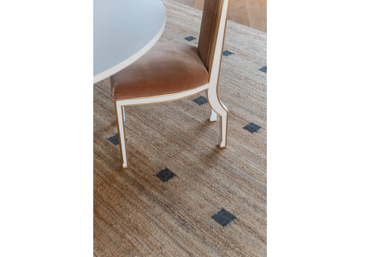 the felix chair can be seen with a kent jute rug.