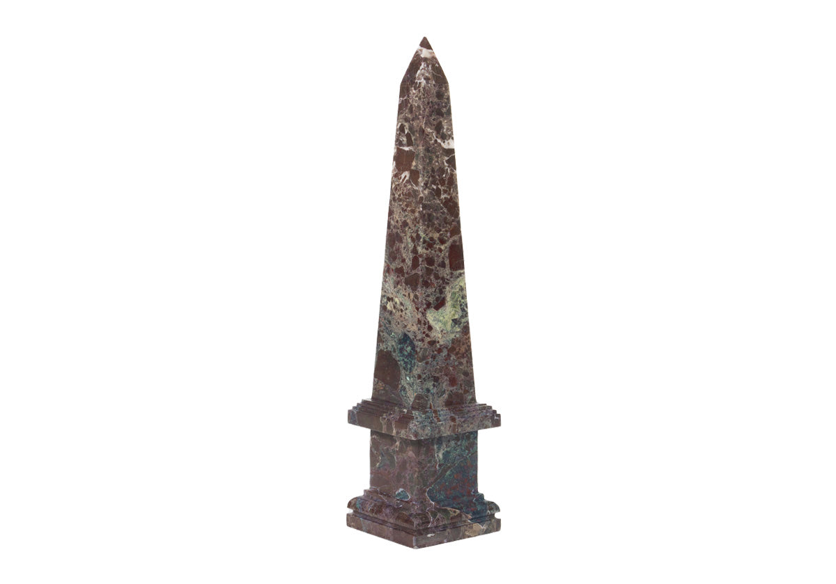 oxblood and Rosso-Levanto marble obelisk seen with white background.