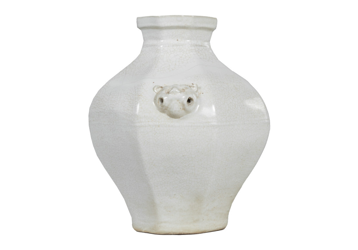 anges jar, large white jar with designs on the sides.