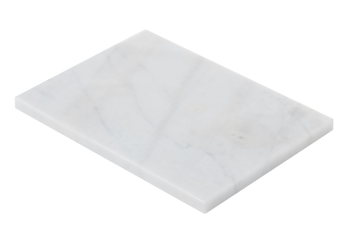 side, down photo of large white cutting board