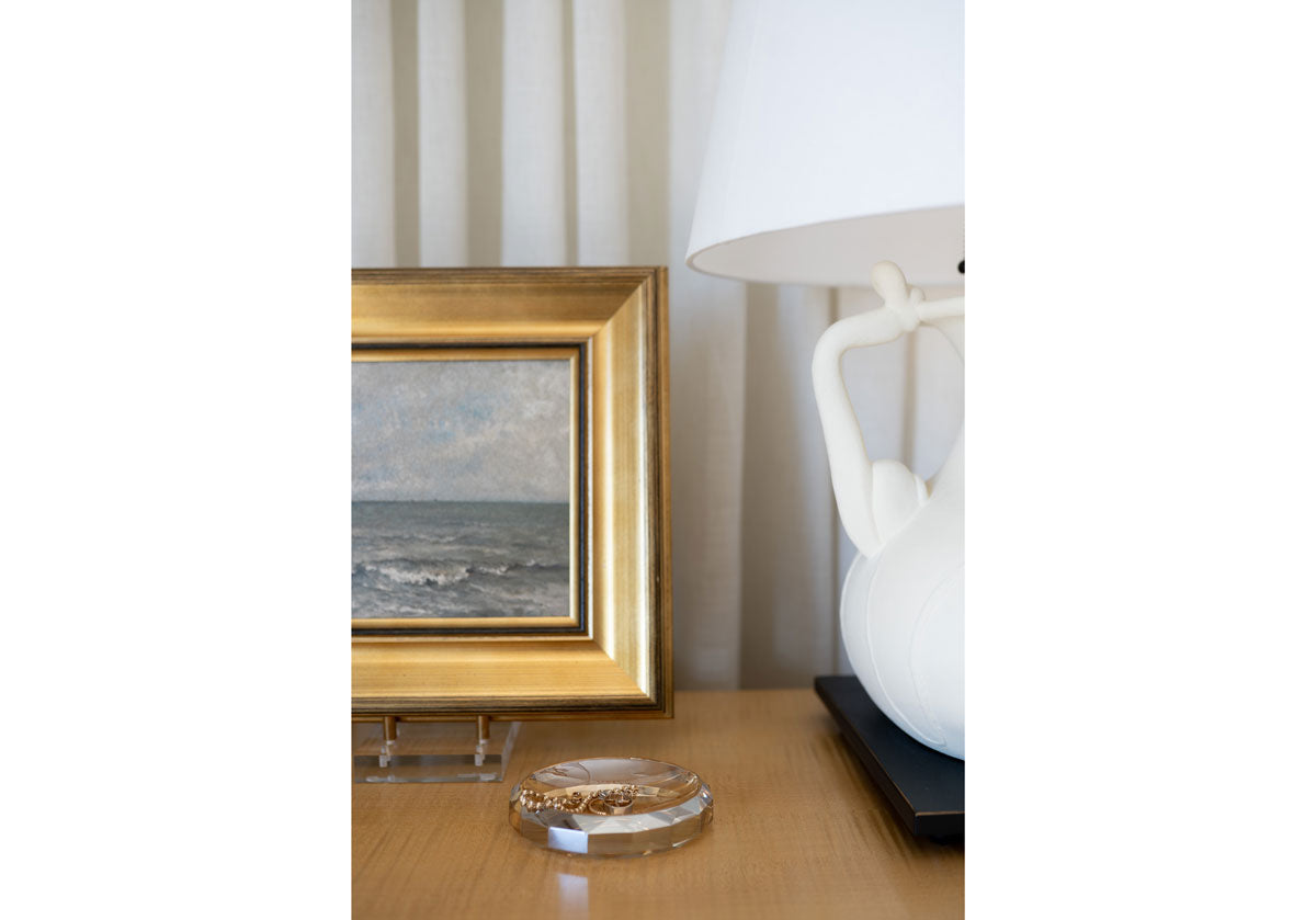 amber crystal dish photo next to a small painting.