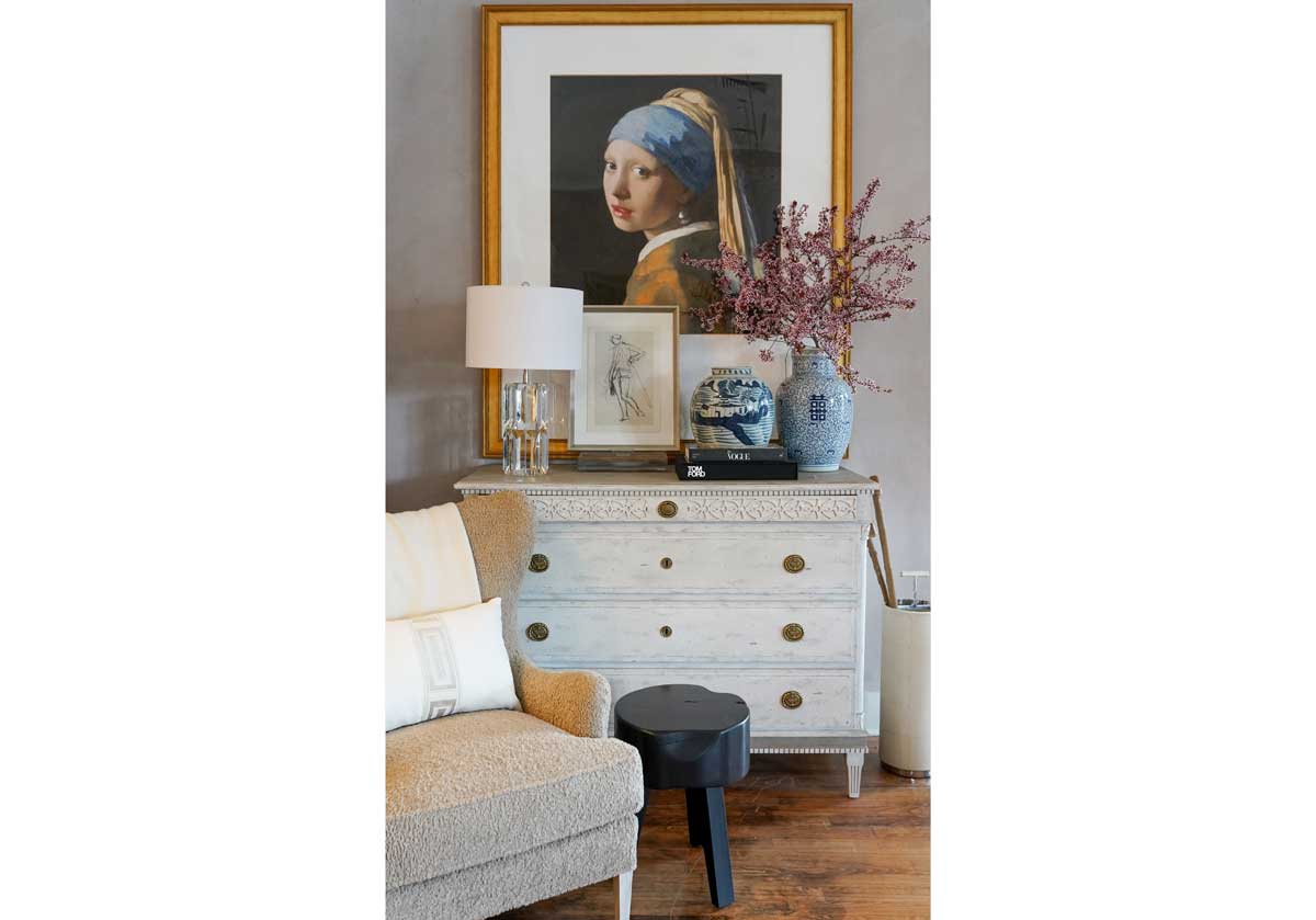 beverly lamp on a dresser seen with girl with the pearl earring painting.