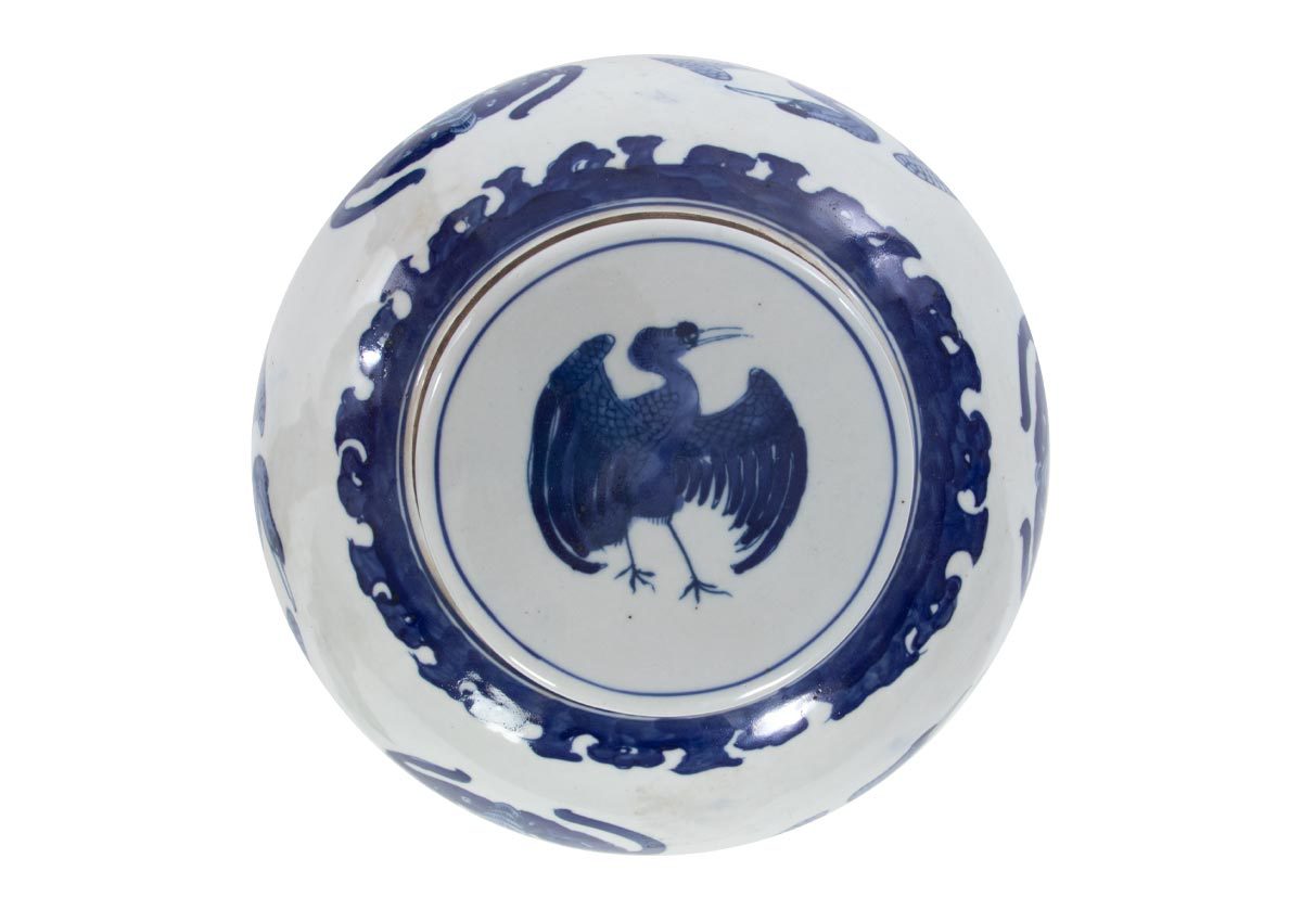 top down photo of the large temple crane jar from alice lane home. with a blue crane at the top of it.