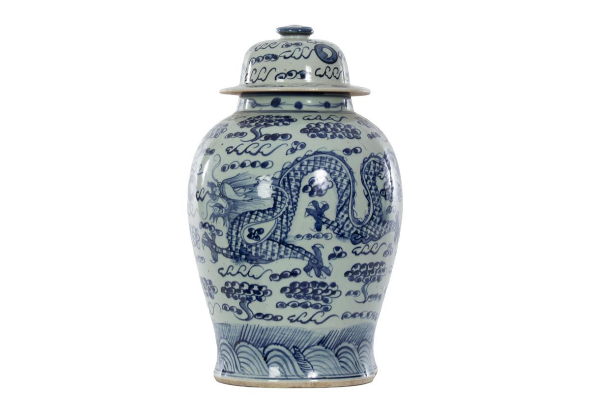 Visually textured, this temple jar is a dramatic addition featuring a dancing dragon surrounded by intricate patterns. Its traditional shape and coloring effortlessly style into entryways and living rooms, lending a cultured touch. 