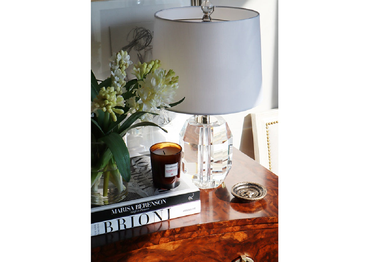 the fiona crystal lamp can be seen on a dresser top with an alice lane candle.
