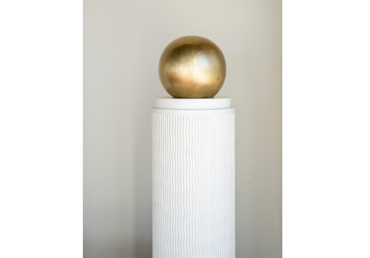 lifestyle photo of atticus column in front of a wall.