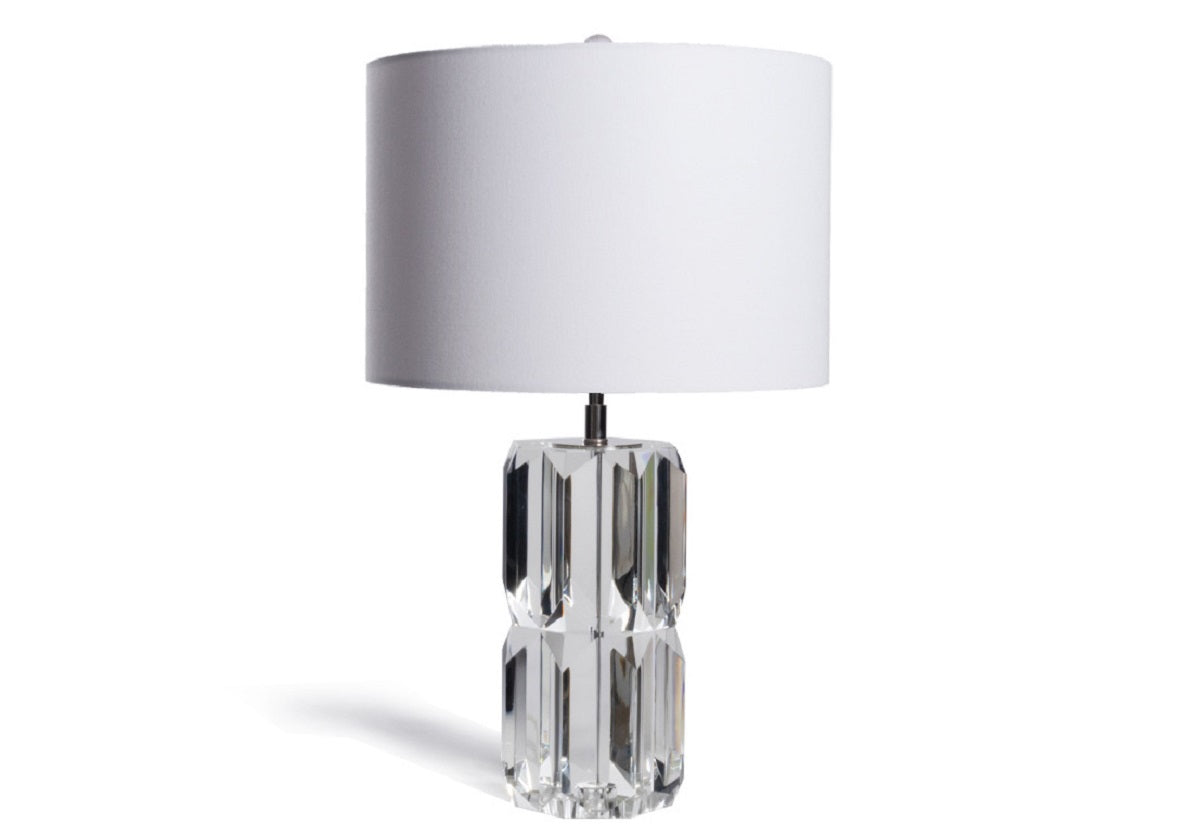 The Beverly features a striking faceted form balanced by a wide, rounded shade and steel hardware. Its luxurious solid K1 crystal base lends a stunning, light-catching look, styling easily on dressers and consoles for a glamorous touch.
