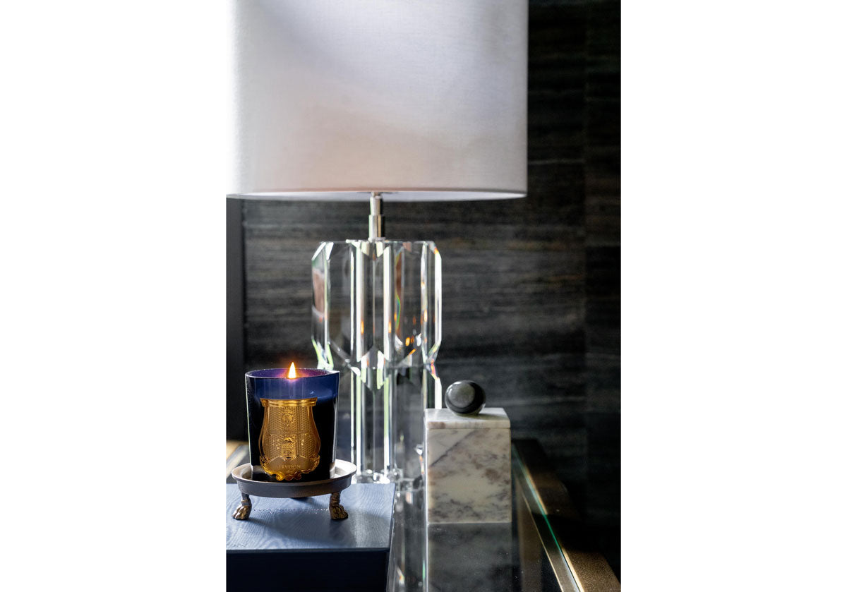 lifestyle photo of the beverly lamp with a candle and the bianco marble box.