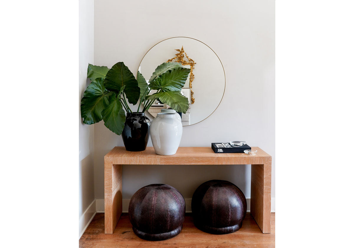 lifestyle shot of the billie snake skin pouf.