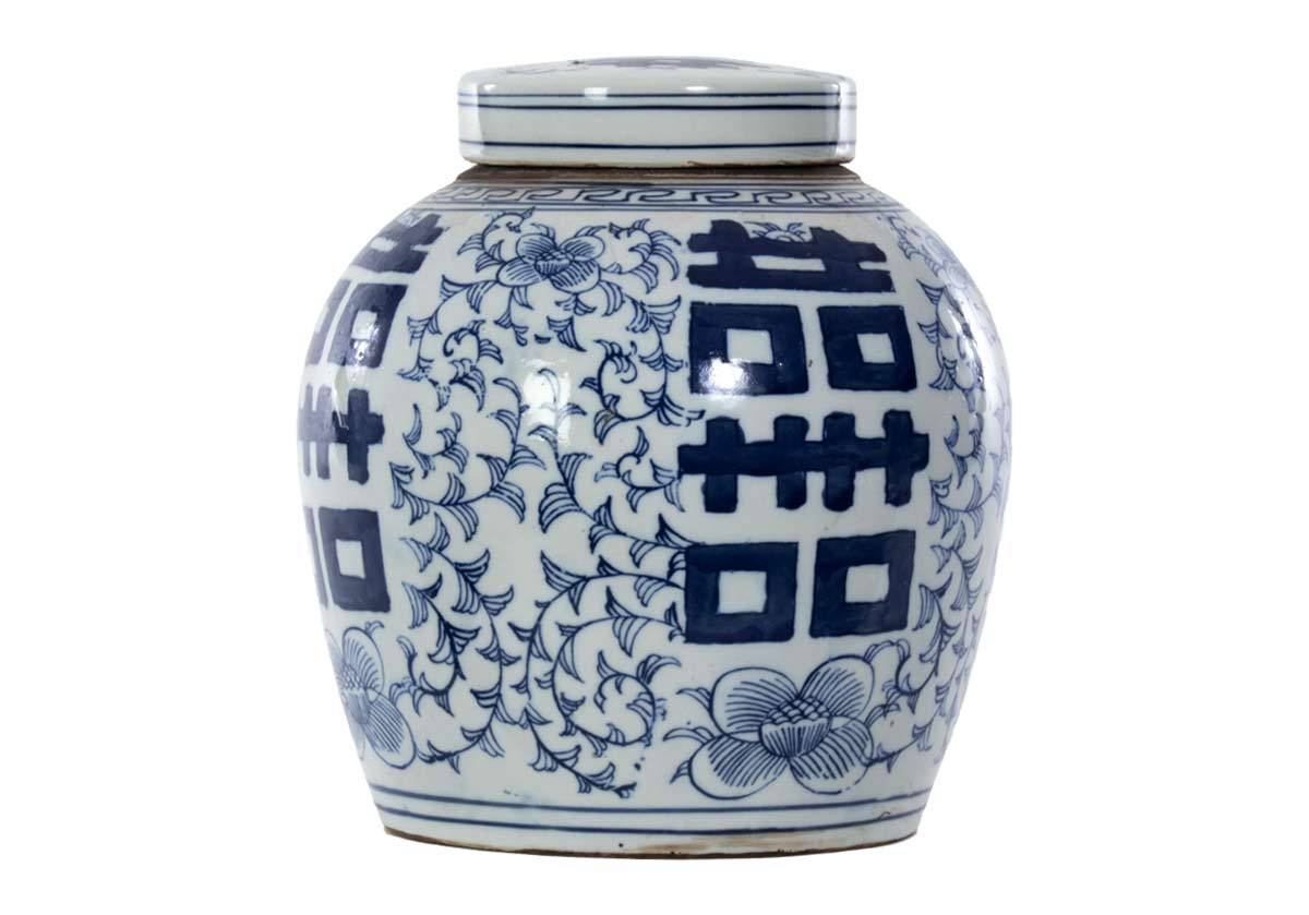 Create a tasteful, cultured look with this rounded temple jar. It boasts large painted symbols offset by delicate flowers, intricate stems, and lined patterns. Its traditional blue and white coloring styles beautifully with faux stems and greenery, lending a fresh, versatile design. 