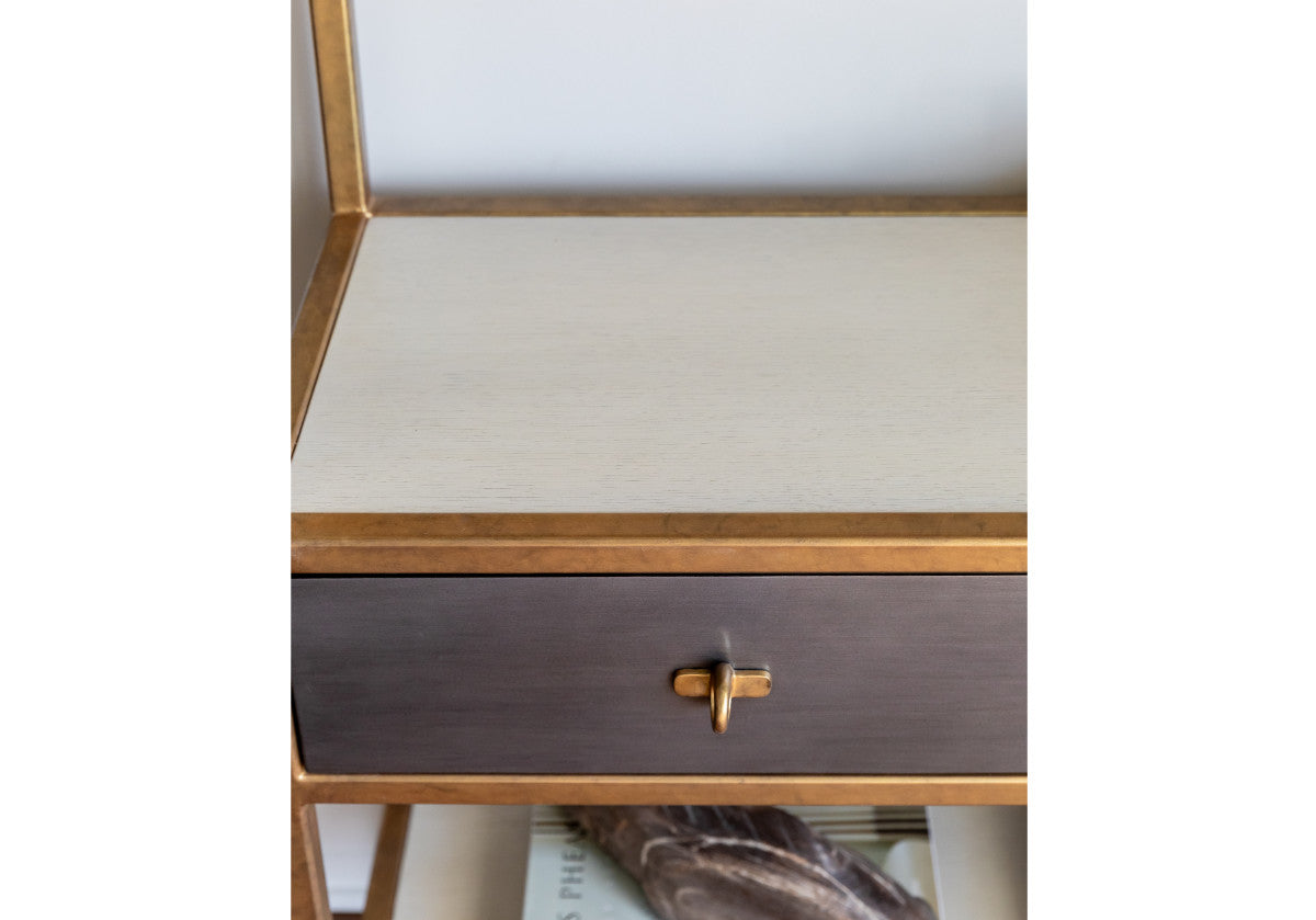 close up of gray drawers from albert etagere with brass hardware. 