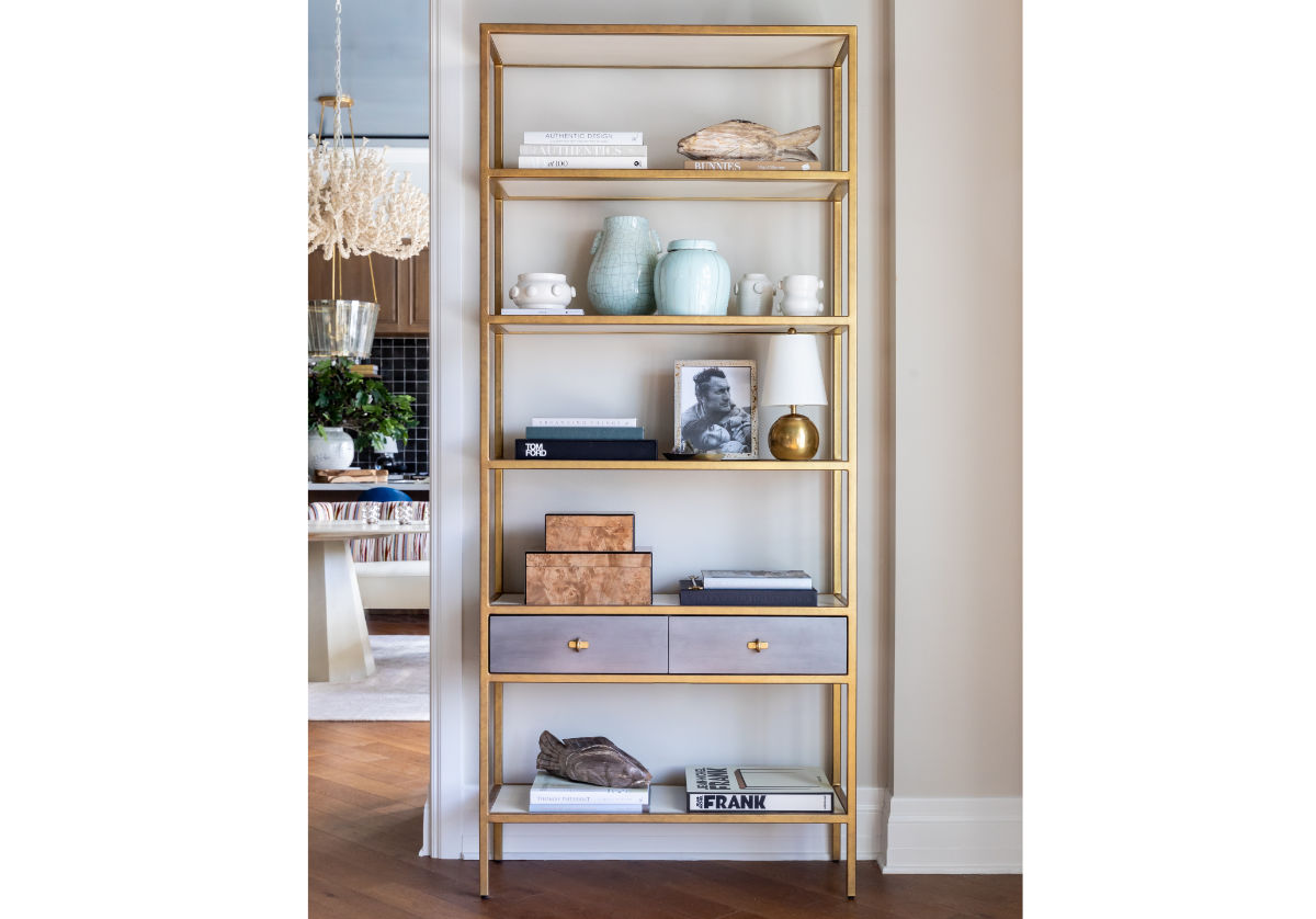 albert etagere with gray shelves and adorned with vases and other accessories 