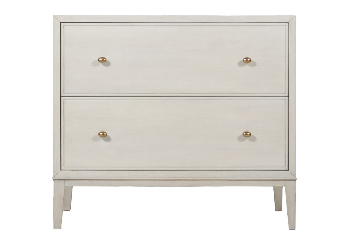 The Ava gives a traditional, timeless elegance to bedrooms with its straightforward form complemented by two large drawers with pencil moulding detailing the border. Antiqued brass egg shaped knobs give sophistication, further elevated by the natural wood grain coming through its neutral finish. Incredibly durable, four tapered legs give an airy feel, pairing easily with traditional and transitional bedrooms.