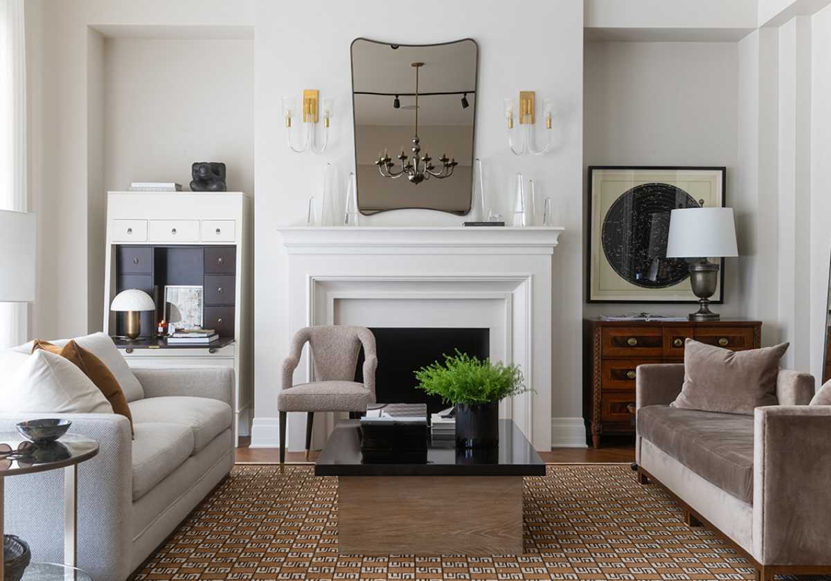 sexxex rug can be seen in the bottom of the photo. the the leo settee and another saof on top. the bobbie chair is off the left of the fireplace mantle succrounded by some dressers. 