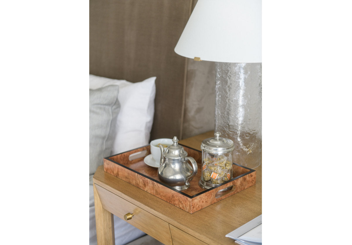 lifestyle photo of the burled wood tray with a tea pot inside of it from alice lane.