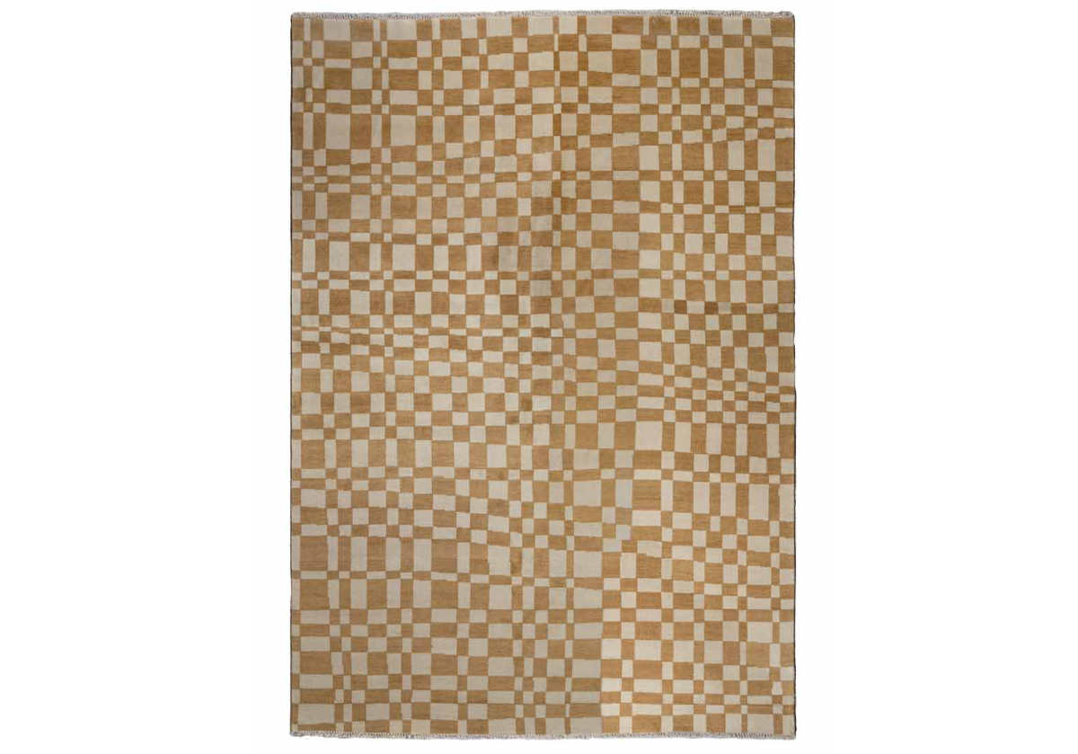 Crafted entirely from New Zealand wool, this rug is one-of-a-kind and completely customizable. Select from a variety of colors and sizing for your own individual style. This statement rug boasts incredible visual dimension with its asymmetrical chess pattern. Its eye-catching coloring is complemented by tassel ends, further elevating its tasteful design.