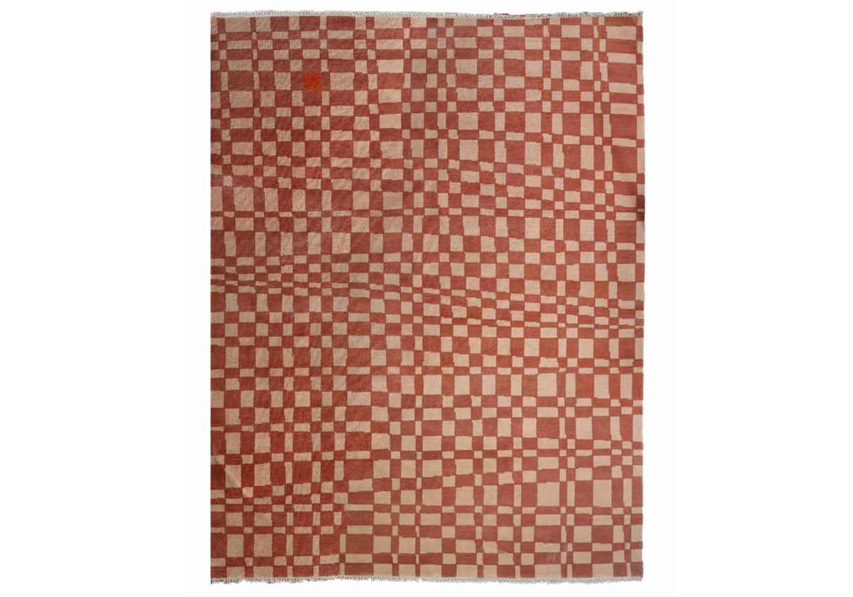 Crafted entirely from New Zealand wool, this rug is one-of-a-kind and completely customizable. Select from a variety of colors and sizing for your own individual style. This statement rug boasts incredible visual dimension with its asymmetrical chess pattern. Its eye-catching coloring is complemented by tassel ends, further elevating its tasteful design.