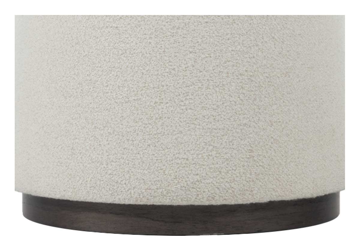 base of This ottoman is versatile with its chic, curved silhouette complemented by an oatmeal boucle upholstery and a dark wood base. Its scaled-down size styles easily throughout the living room, pairing well with sofas and chairs.