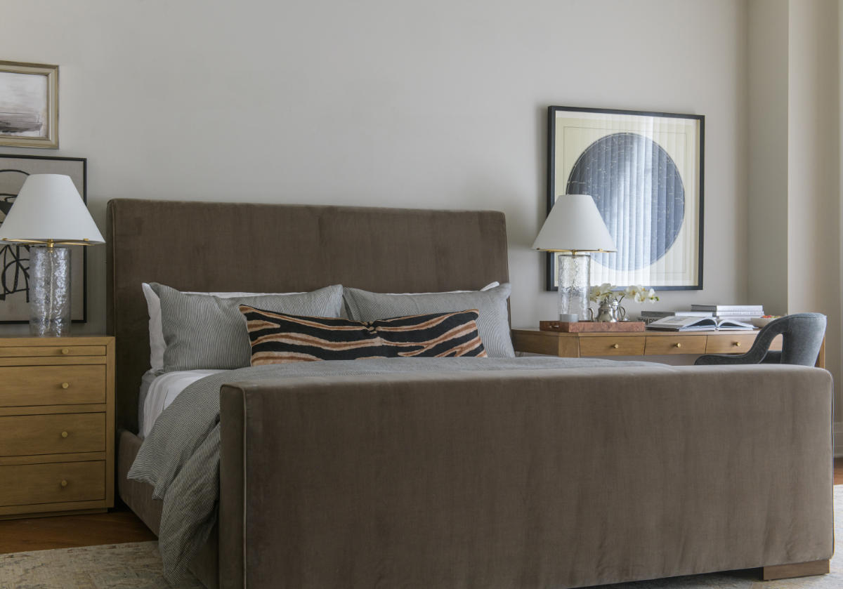 the monroe bed is featured in this photo with the brooklyn desk to the right of it, bobbie chair. and to the left is a bedroom dresser with a lamp. 