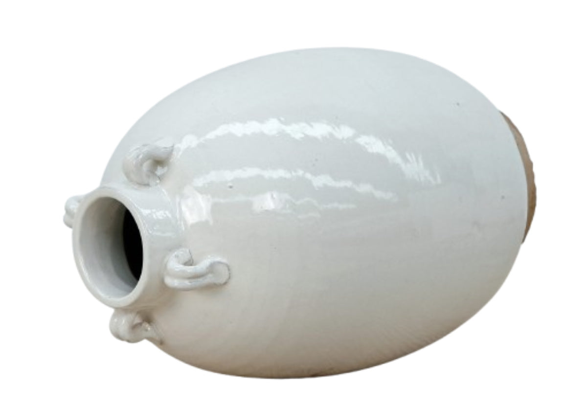 large ceramic white jar laying on side