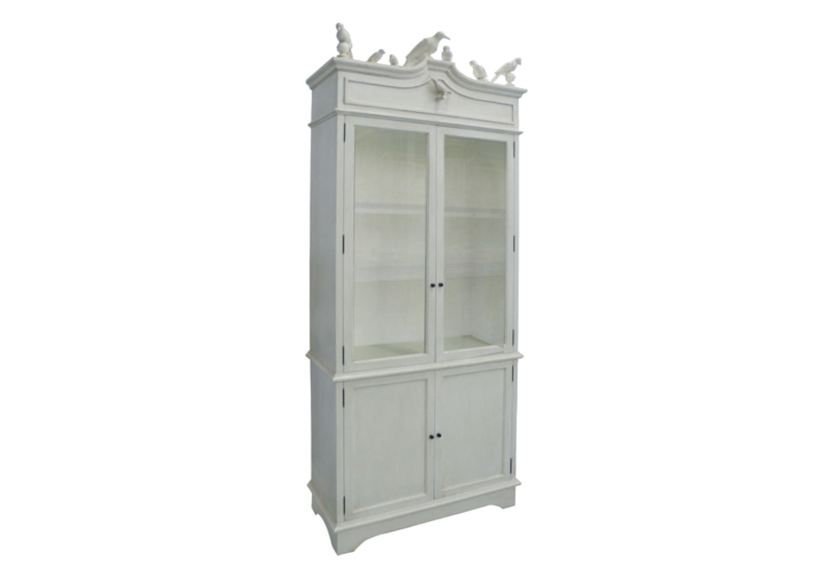 tall white cabinet with white birds on the top. two alarge glass frames on the front and two large drawers on the bottom. 