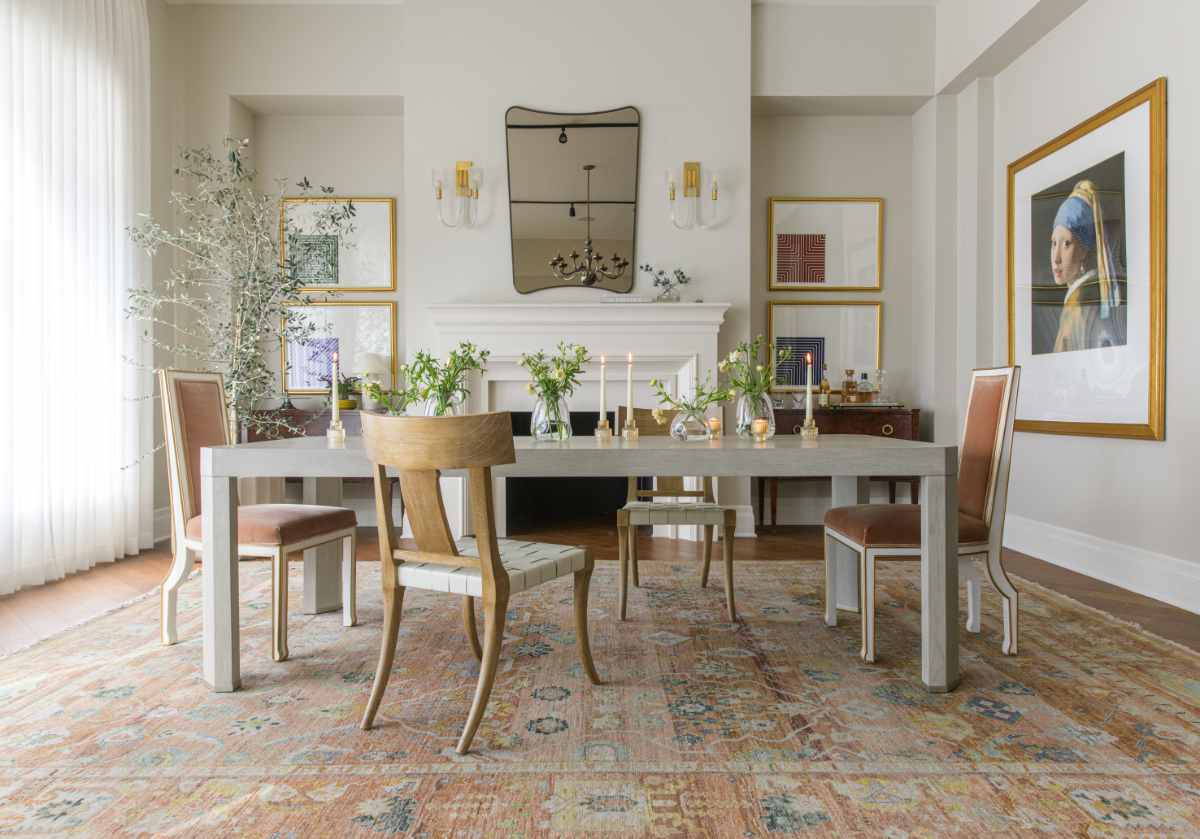 the arthur table can be seen adorned with candles and vases, with the felix chair next to it on either ends. The girl with the pearl earring can also be seen to the right of the photo. 