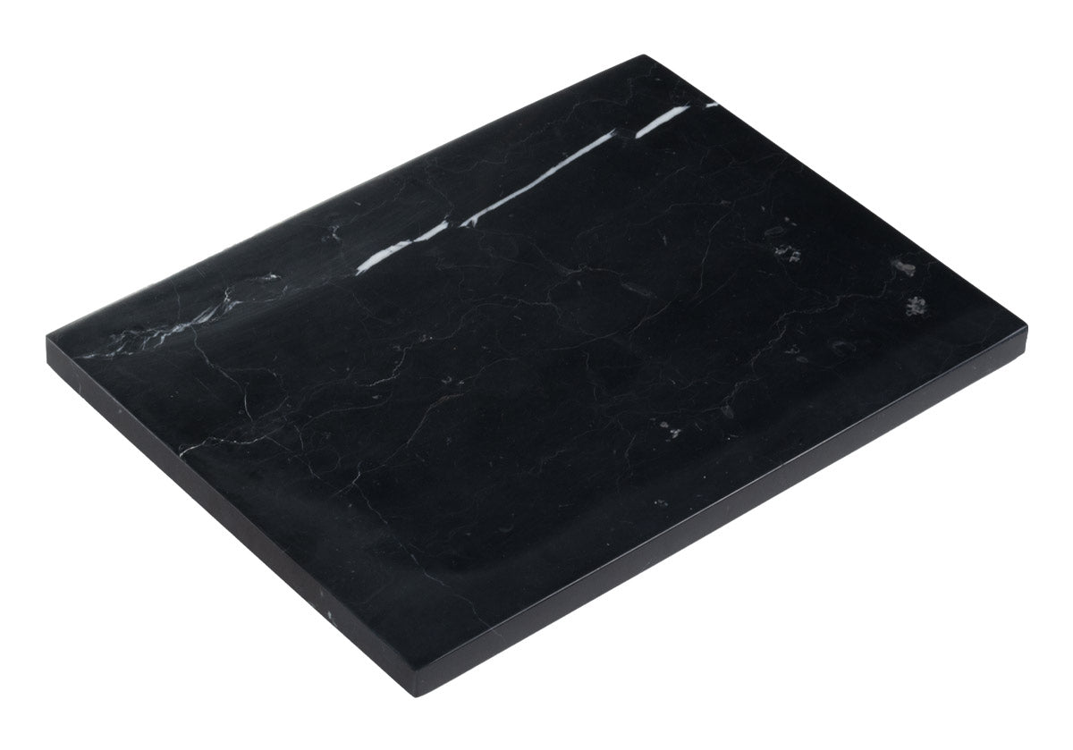 photo of large black marble cutting board pictured on white background. 