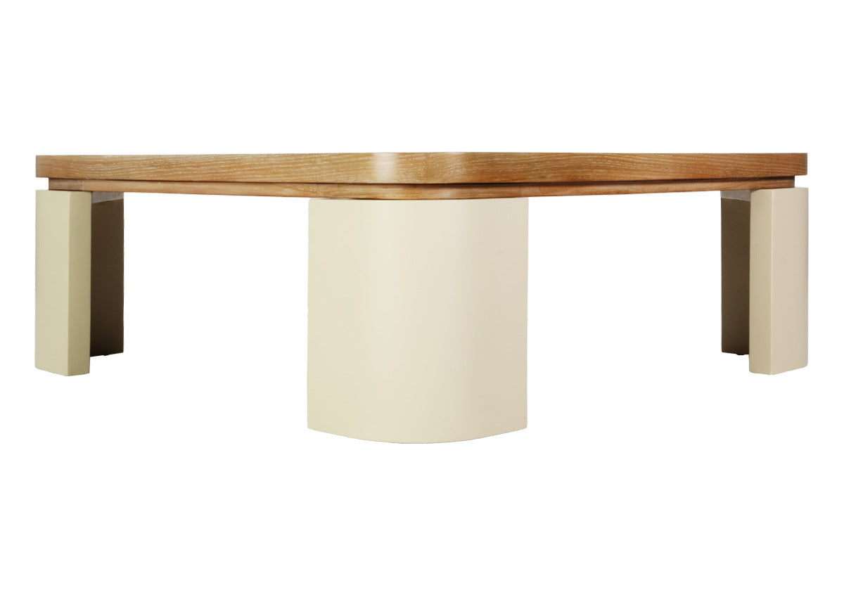 The Blair Cocktail Table makes a sculptural statement with its spacious white oak top elevated by four radius legs. The natural wood graining and patterning provide a beautiful contrast to its smooth, creamy base for an elevated design.