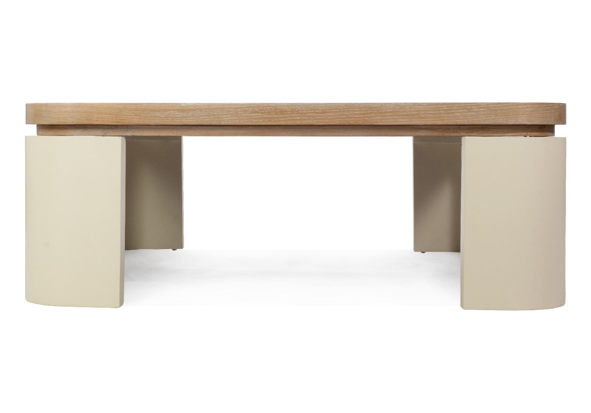 The Blair Cocktail Table makes a sculptural statement with its spacious white oak top elevated by four radius legs. The natural wood graining and patterning provide a beautiful contrast to its smooth, creamy base for an elevated design.