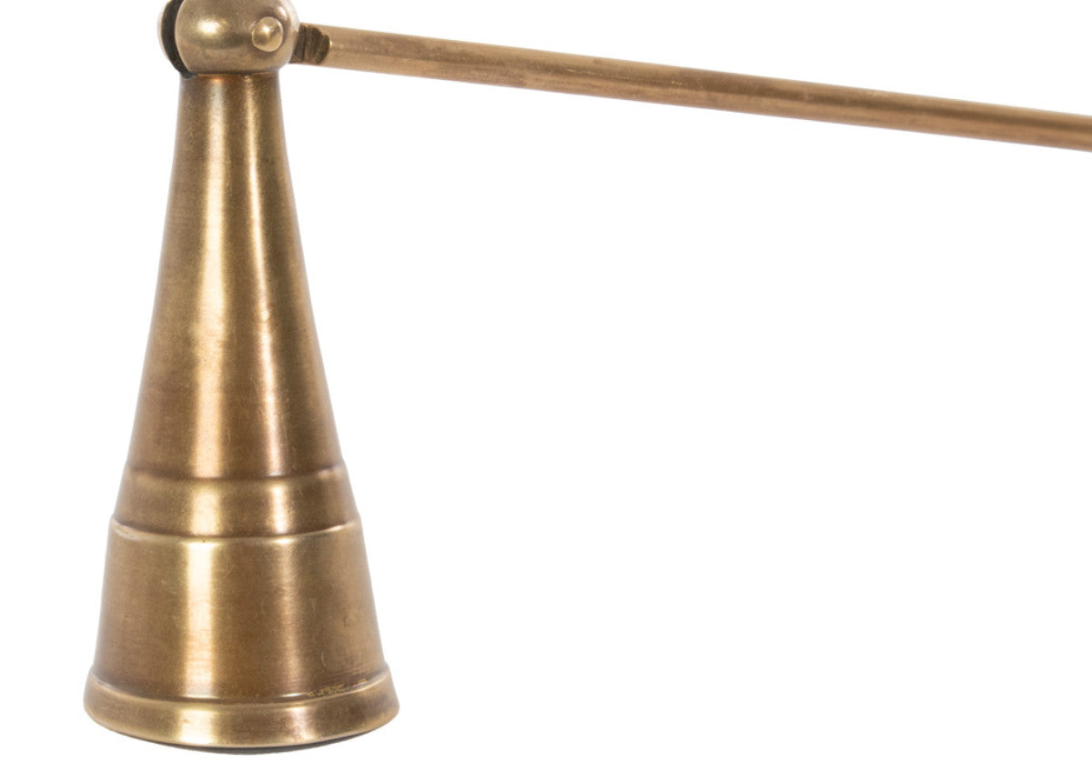 close up of brass candle snuffer head. 