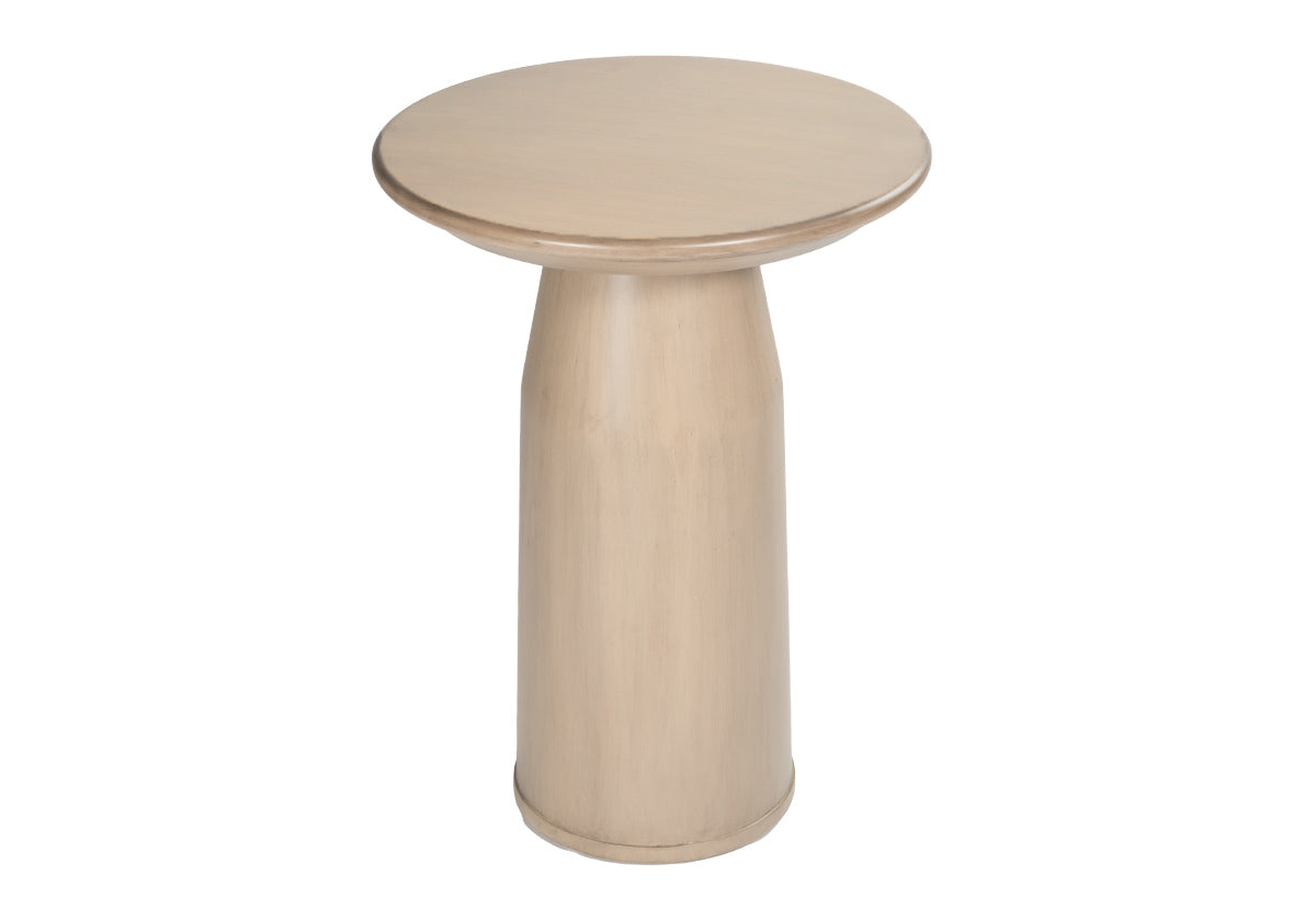 angled picture of small, tan side table. Cylindrical base with round top.