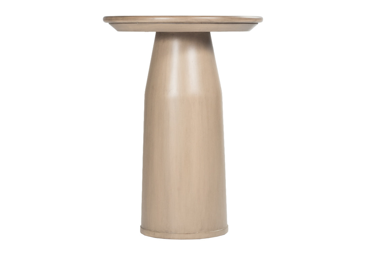 small, tan side table. Cylindrical base with round top.