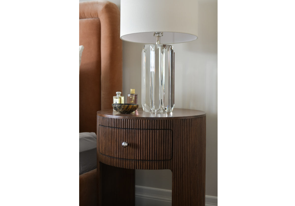 lifestyle shot of the beverly lamp on the cleo nightstand. 